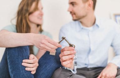 man and woman with two keys