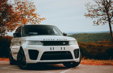 white range rover on the road